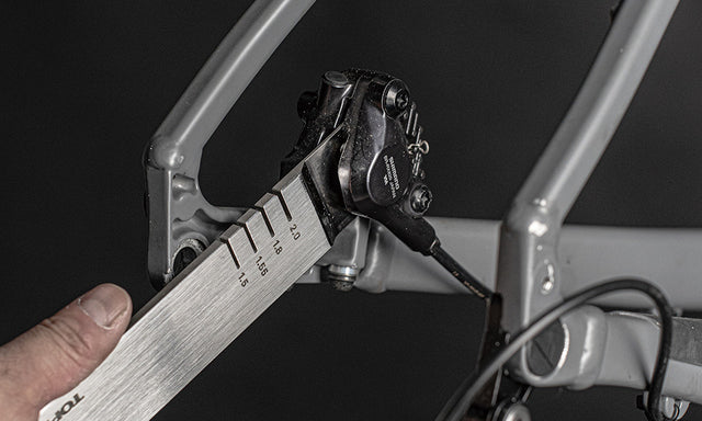 Topeak Rotor Truing Tool trykker kaliberstempler tilbage